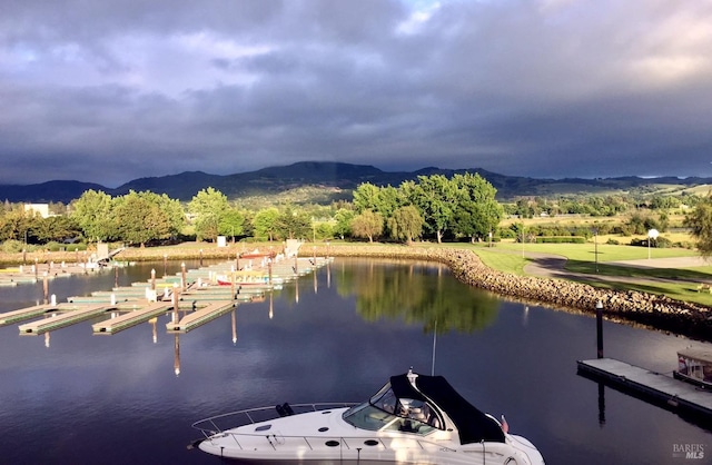 dock area with a water and mountain view