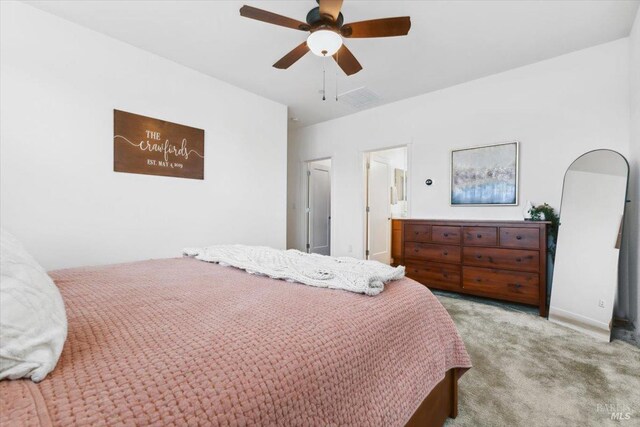 carpeted bedroom with a ceiling fan