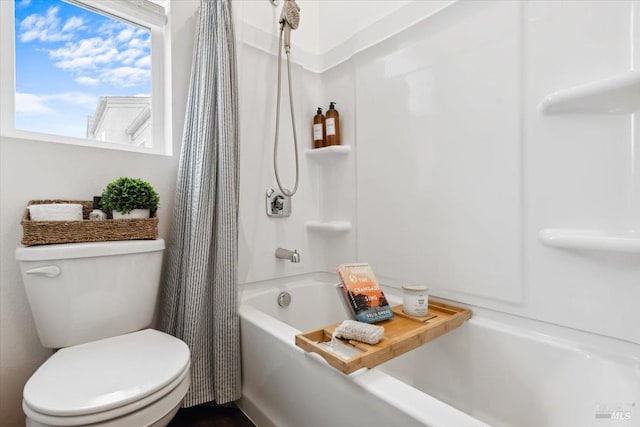full bath with toilet and shower / tub combo with curtain