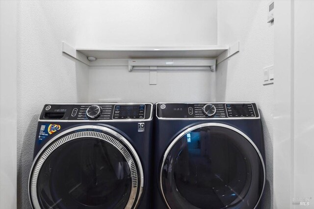 laundry area with separate washer and dryer and laundry area
