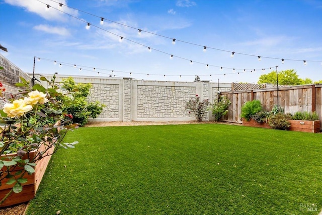 view of yard with fence