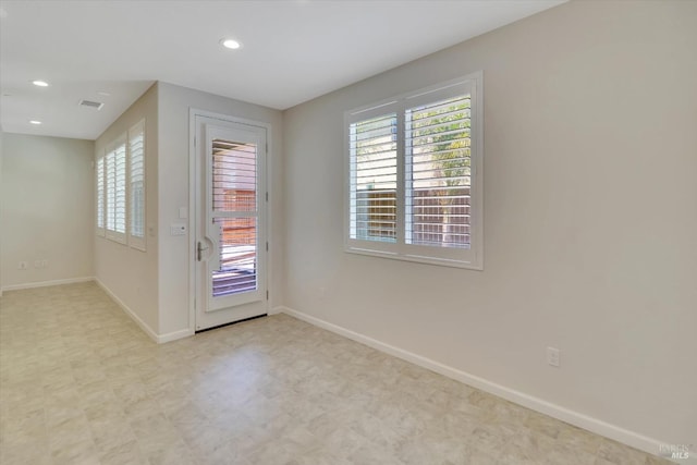 entryway with tile patterned floors, baseboards, recessed lighting, and visible vents