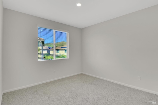 unfurnished room with baseboards, carpet flooring, and recessed lighting