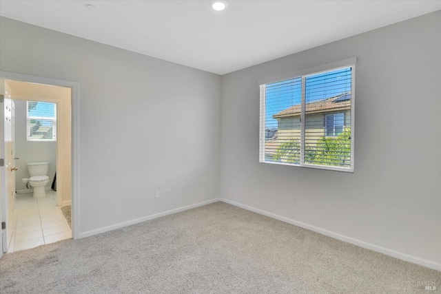 carpeted spare room with baseboards and recessed lighting