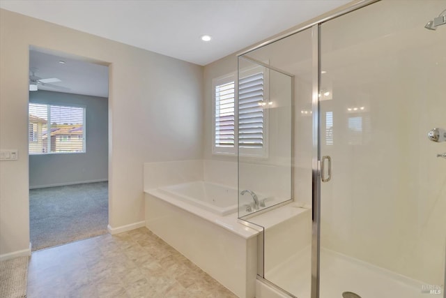 full bath featuring ceiling fan, tile patterned floors, baseboards, a bath, and a stall shower