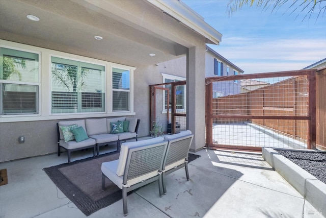 view of patio / terrace featuring fence and an outdoor living space