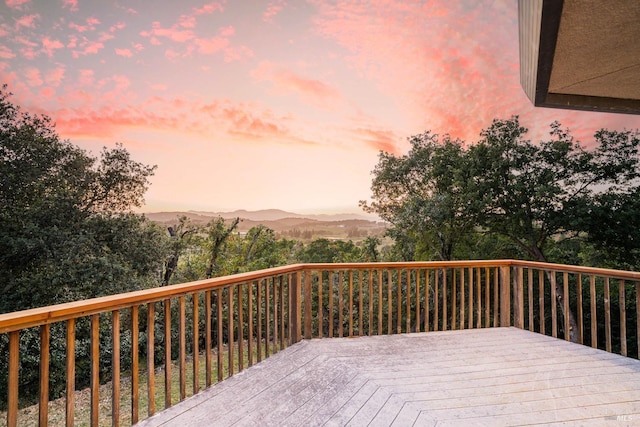 deck at dusk with a mountain view
