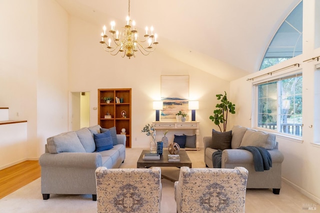 living area with an inviting chandelier, high vaulted ceiling, plenty of natural light, and baseboards