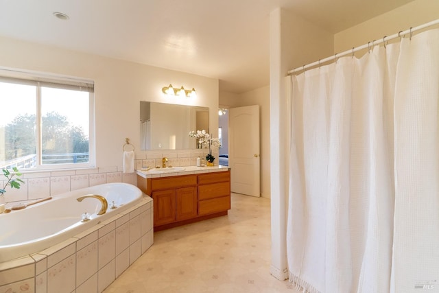 bathroom featuring tile patterned floors, a shower with shower curtain, a bath, and vanity