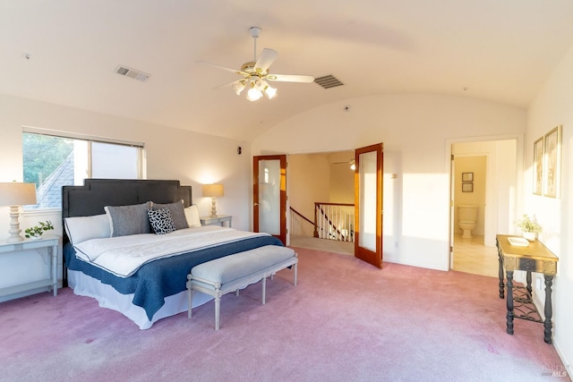 bedroom featuring visible vents, ceiling fan, lofted ceiling, and light carpet