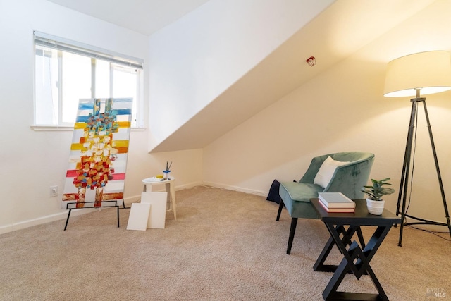 sitting room with baseboards and carpet flooring