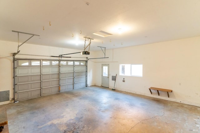 garage featuring baseboards and a garage door opener