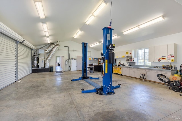 3785 Roblar Rd, Petaluma, CA 94952 - garage featuring water heater, freestanding refrigerator, and a workshop area