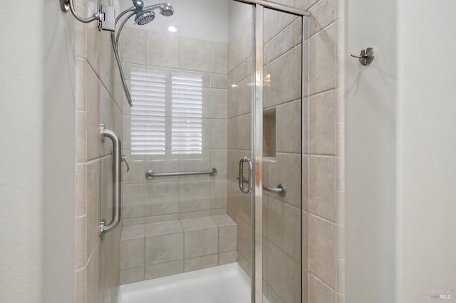 bathroom with a shower stall