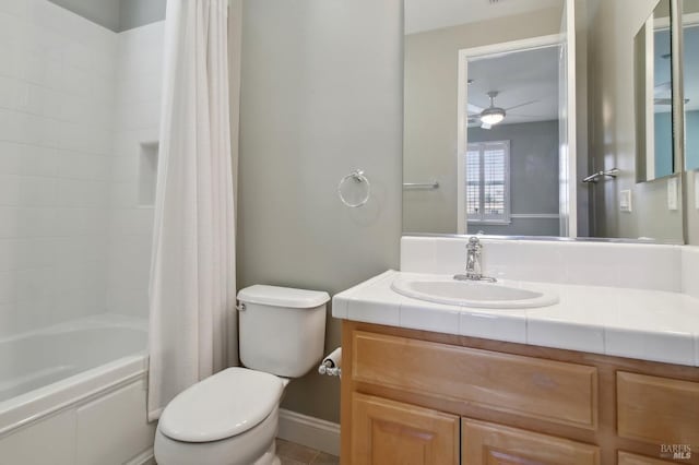 full bathroom with vanity, ceiling fan, shower / bath combo with shower curtain, and toilet
