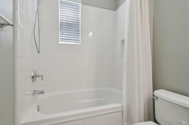full bathroom with shower / tub combo with curtain and toilet