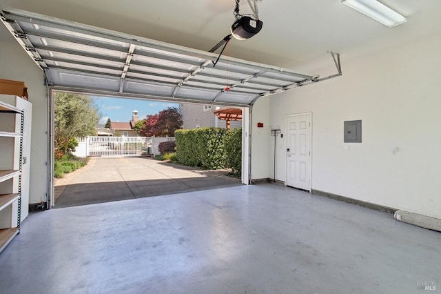garage featuring a garage door opener and electric panel