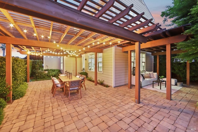 view of patio / terrace featuring a pergola, an outdoor hangout area, and outdoor dining space