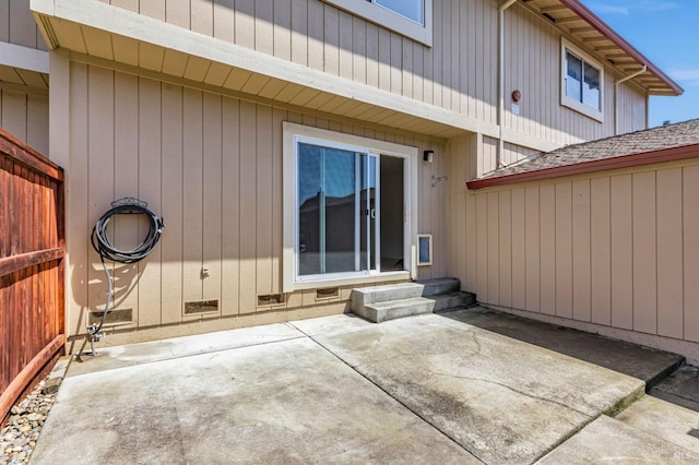 rear view of property featuring a patio and entry steps
