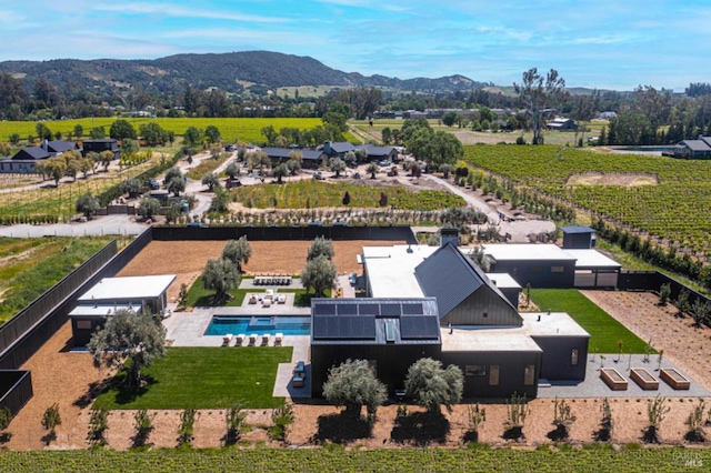 drone / aerial view featuring a mountain view and a rural view