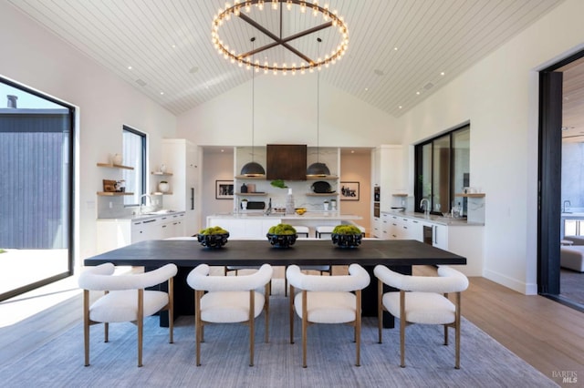 dining space with high vaulted ceiling, recessed lighting, a chandelier, wooden ceiling, and light wood finished floors