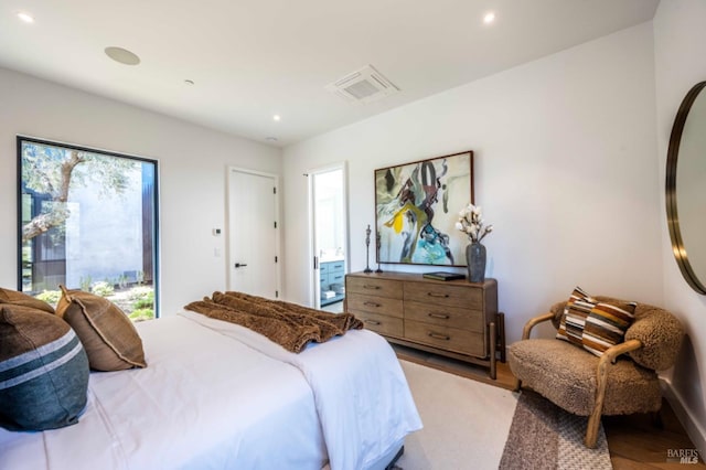 bedroom with visible vents, recessed lighting, and light wood-type flooring