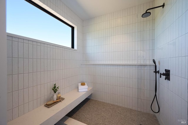 full bathroom with a tile shower