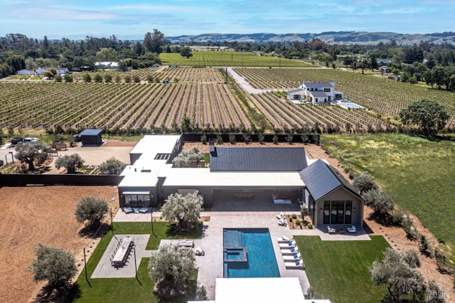 birds eye view of property featuring a rural view