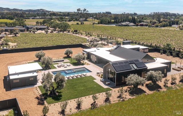 birds eye view of property with a rural view