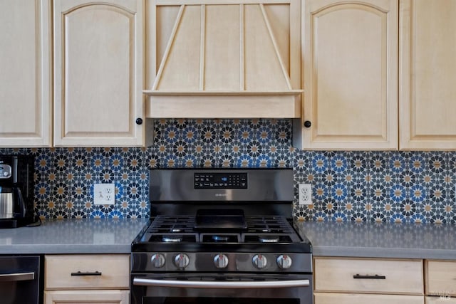 kitchen with light brown cabinets, decorative backsplash, custom exhaust hood, and gas range