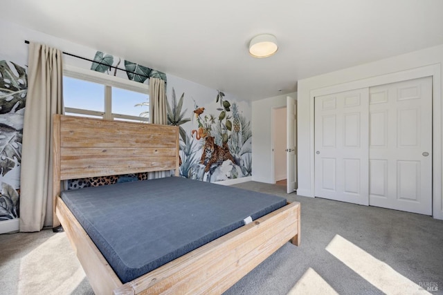 carpeted bedroom with a closet