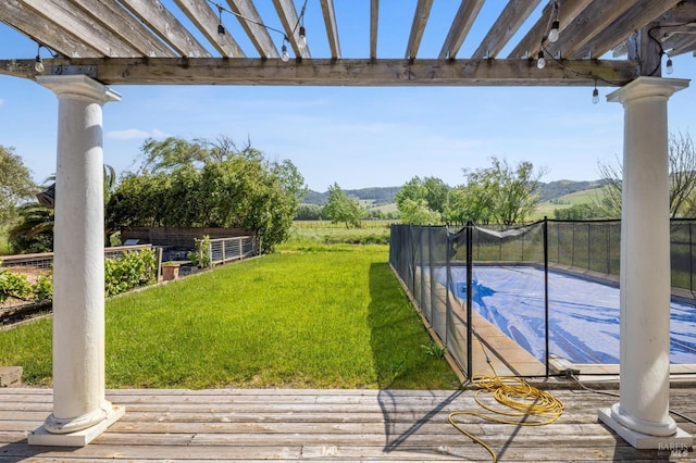 view of yard with a mountain view and fence