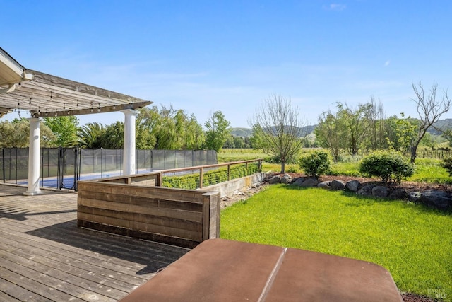 exterior space featuring a lawn, a pergola, fence, and a garden