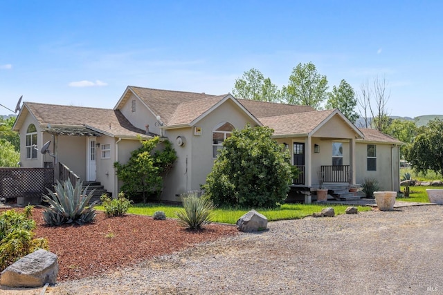 ranch-style home with stucco siding
