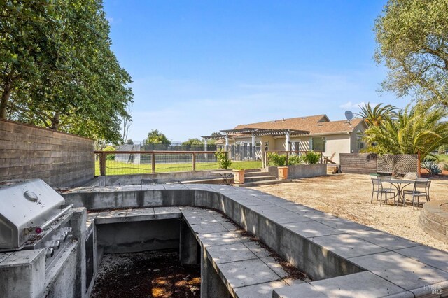 exterior space with a fenced backyard and a pergola