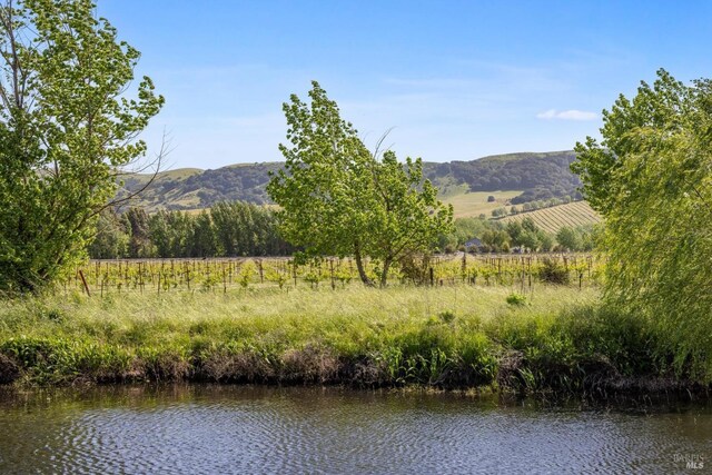 mountain view featuring a rural view