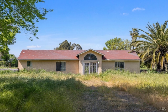 single story home with stucco siding