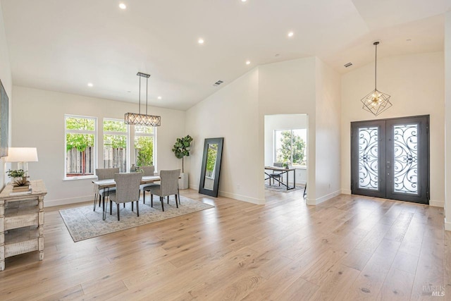 dining room with plenty of natural light, recessed lighting, visible vents, and french doors