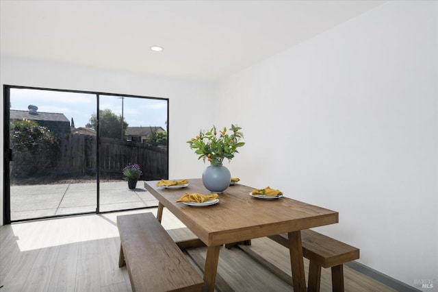 dining space featuring recessed lighting and wood finished floors