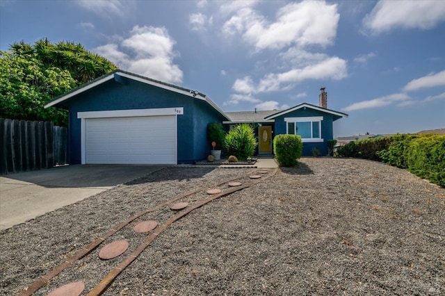 single story home with driveway, a chimney, fence, an attached garage, and stucco siding