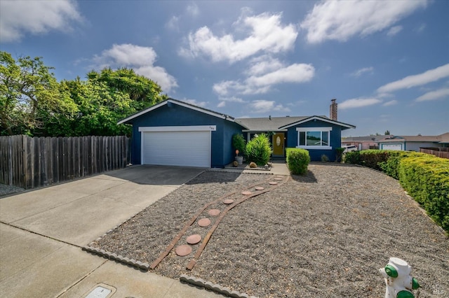 ranch-style home with a garage, fence, stucco siding, a chimney, and concrete driveway