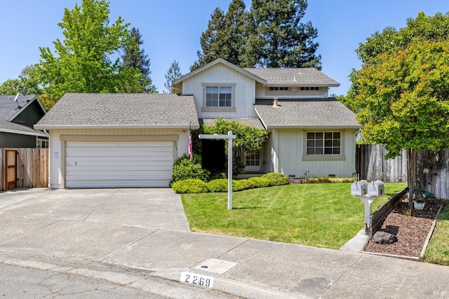 traditional-style house with fence, a shingled roof, concrete driveway, and a garage