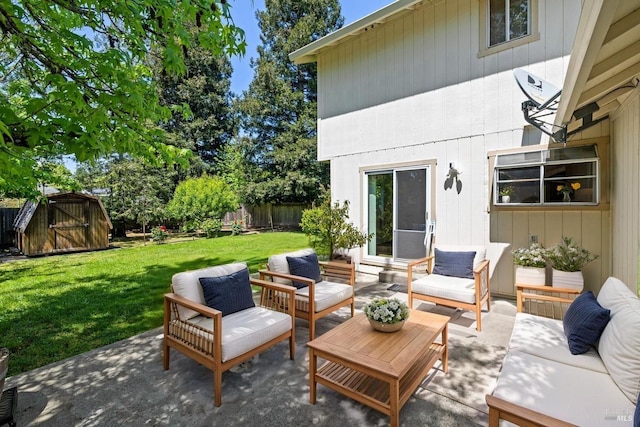 view of patio / terrace with a storage shed, outdoor lounge area, an outbuilding, and a fenced backyard