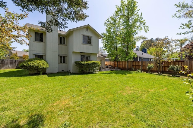 exterior space featuring a yard and a fenced backyard