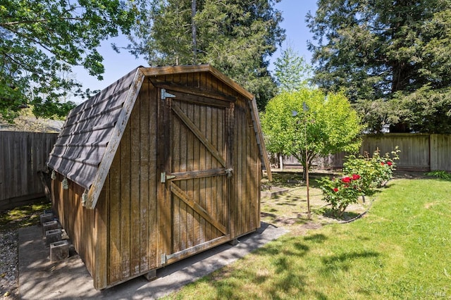 view of shed with a fenced backyard