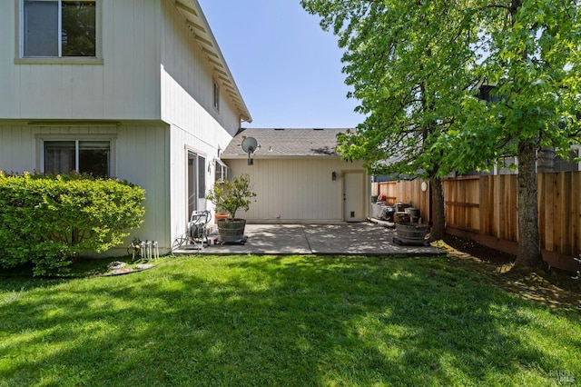back of house with a lawn, a patio area, and fence private yard