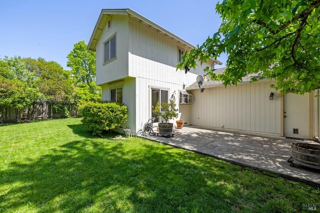 back of house with a patio, central AC unit, fence, and a yard