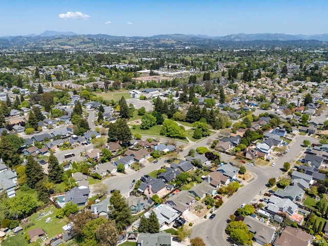 birds eye view of property featuring a mountain view and a residential view