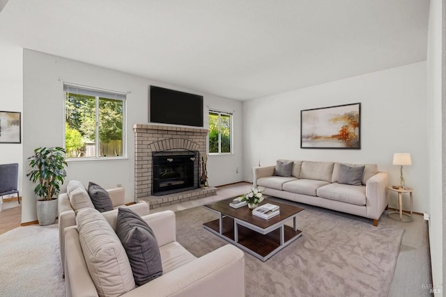 carpeted living room with plenty of natural light and a fireplace