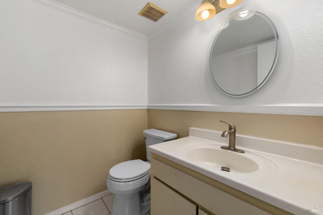 half bath featuring visible vents, tile patterned floors, vanity, toilet, and ornamental molding
